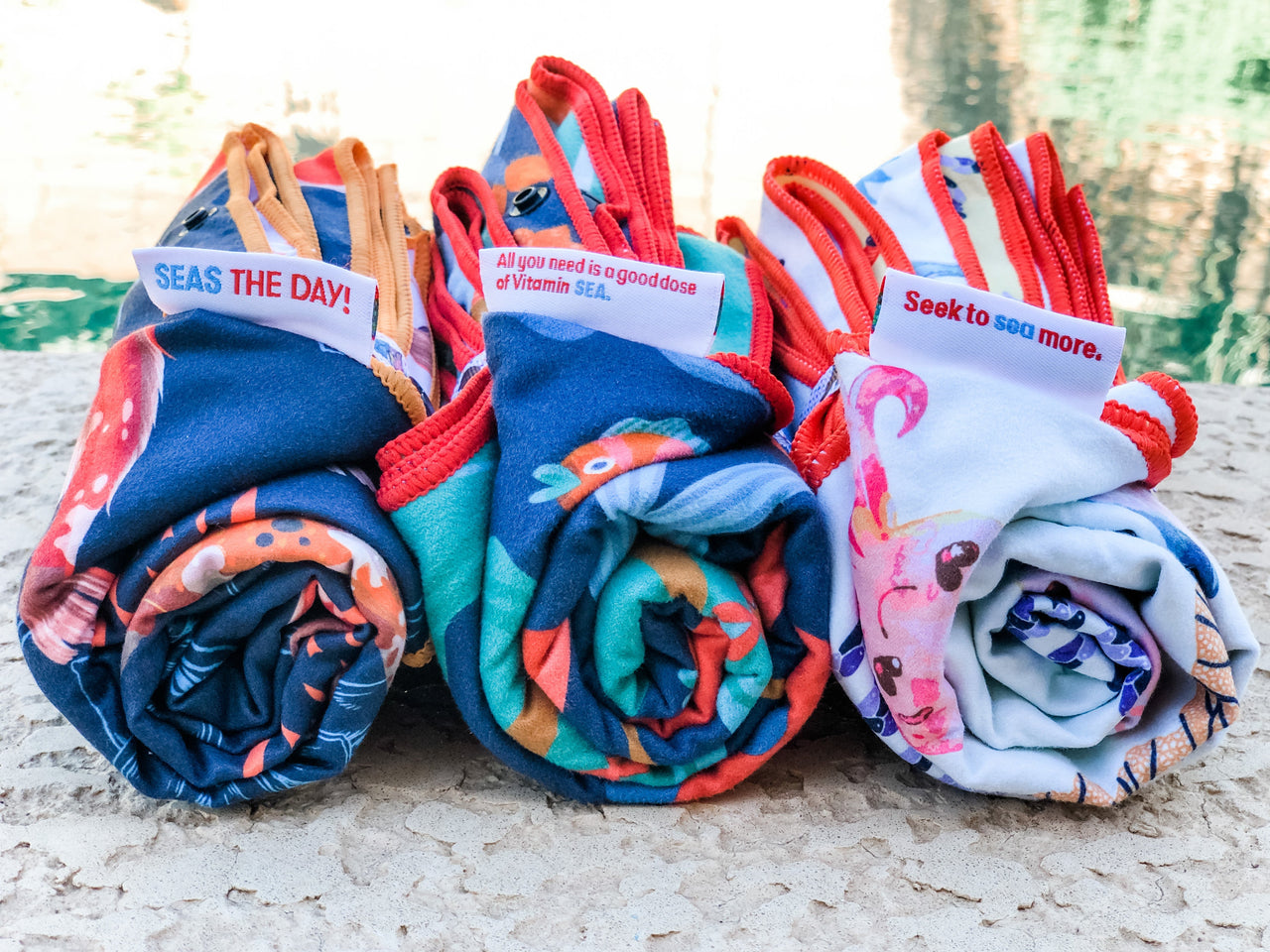 three rolled swim towels