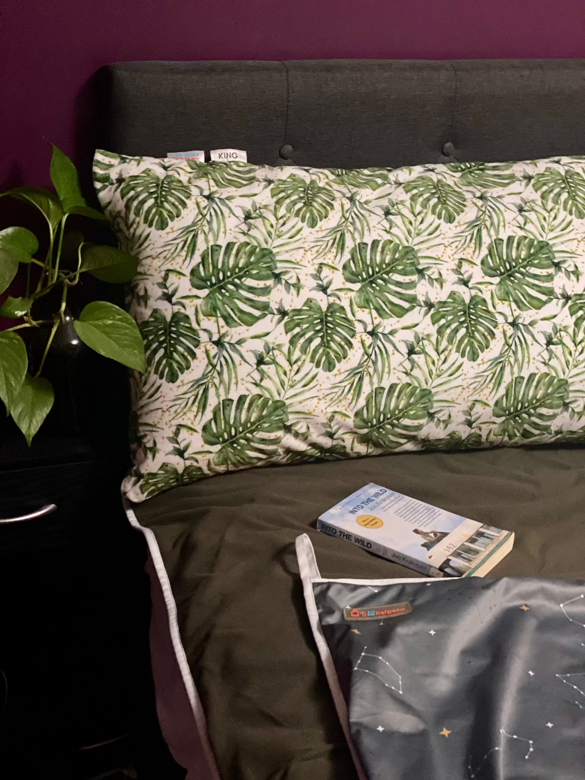 multi-purpose mat folded on top of a chair that is facing the lake